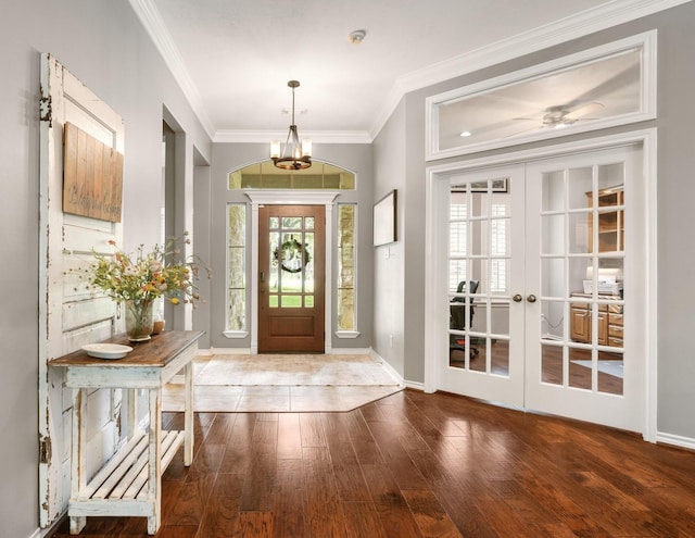 28622 Champions Dr, Magnolia, TX 77355 - entrance foyer with ornamental molding, wood finished floors, a chandelier, and french doors