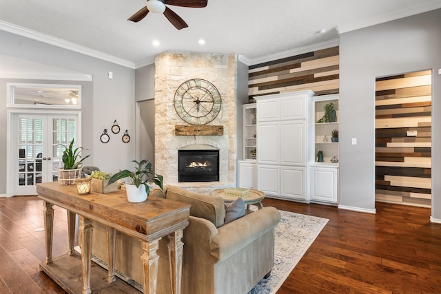 28622 Champions Dr, Magnolia, TX 77355 - living area with ceiling fan, crown molding, dark wood finished floors, a stone fireplace, and recessed lighting