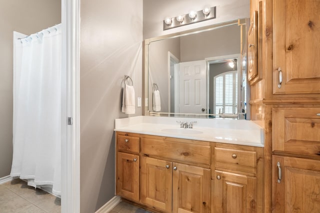 28622 Champions Dr, Magnolia, TX 77355 - full bathroom with vanity, tile patterned flooring, and a shower with shower curtain