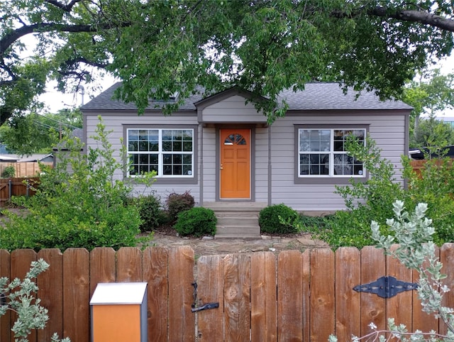 1100 Clayton Ln, Austin, TX 78723 - view of front facade featuring roof with shingles