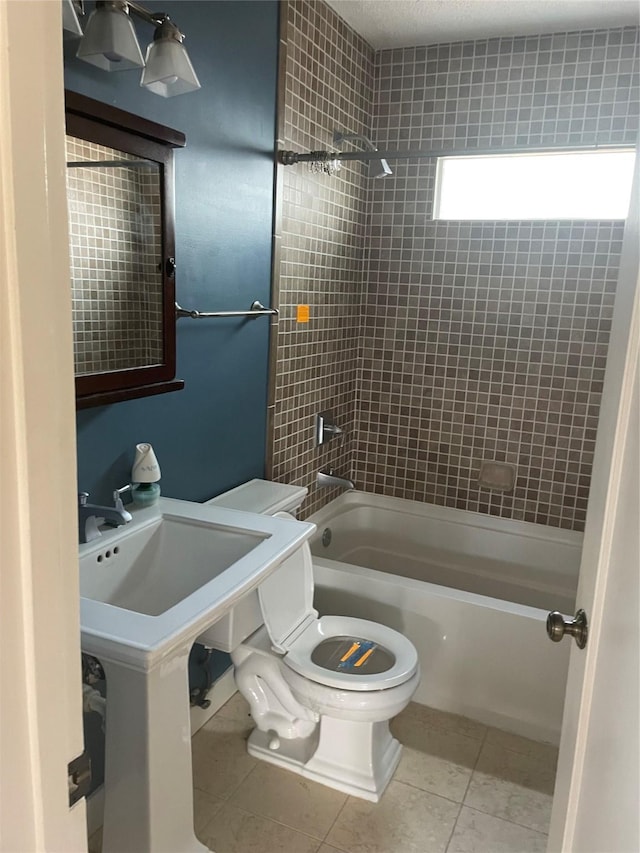 1100 Clayton Ln, Austin, TX 78723 - full bath featuring toilet, shower / bathtub combination, and tile patterned floors