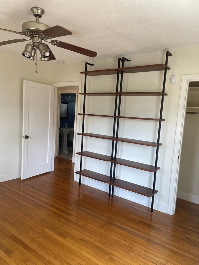 1100 Clayton Ln, Austin, TX 78723 - unfurnished bedroom featuring baseboards and light wood-style flooring