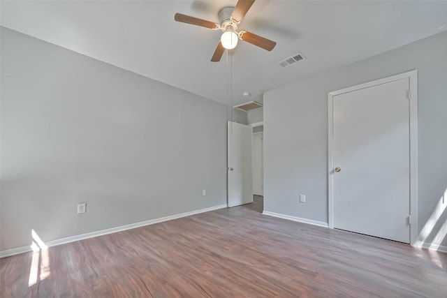 3918 Tavenor Ln, Houston, TX 77047 - unfurnished bedroom with wood finished floors, baseboards, and a ceiling fan