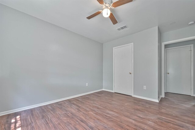 3918 Tavenor Ln, Houston, TX 77047 - unfurnished bedroom featuring wood finished floors, baseboards, and a ceiling fan