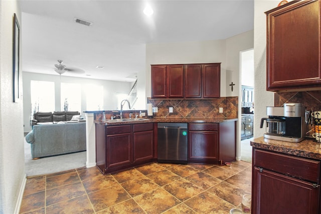 19034 Ashford Square St, Tomball, TX 77375 - kitchen with stainless steel dishwasher, dark brown cabinets, dark countertops, backsplash, and open floor plan