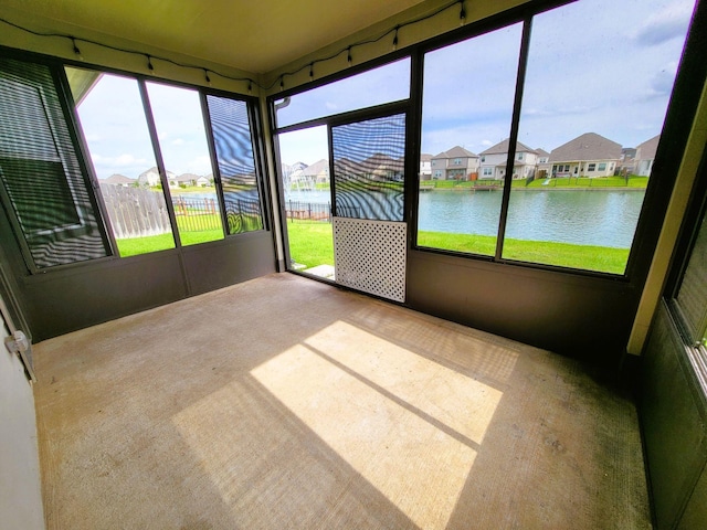 24703 Allori Ct, Katy, TX 77493 - unfurnished sunroom featuring a water view and a residential view
