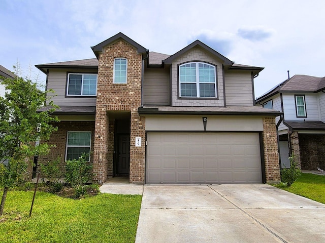 24703 Allori Ct, Katy, TX 77493 - traditional home featuring an attached garage, driveway, brick siding, and a front yard