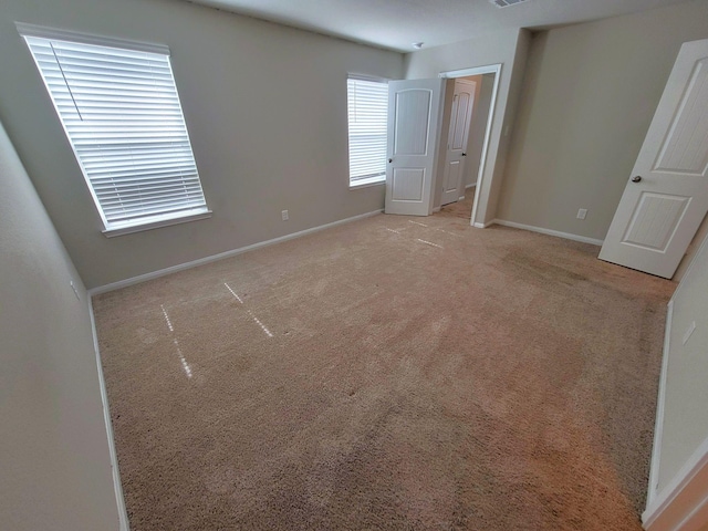 24703 Allori Ct, Katy, TX 77493 - unfurnished bedroom featuring baseboards and carpet flooring