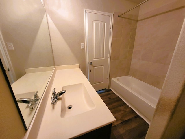 24703 Allori Ct, Katy, TX 77493 - full bathroom featuring vanity, wood finished floors, and bathing tub / shower combination
