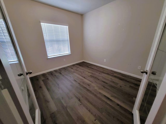 24703 Allori Ct, Katy, TX 77493 - spare room featuring dark wood-style flooring, baseboards, and french doors