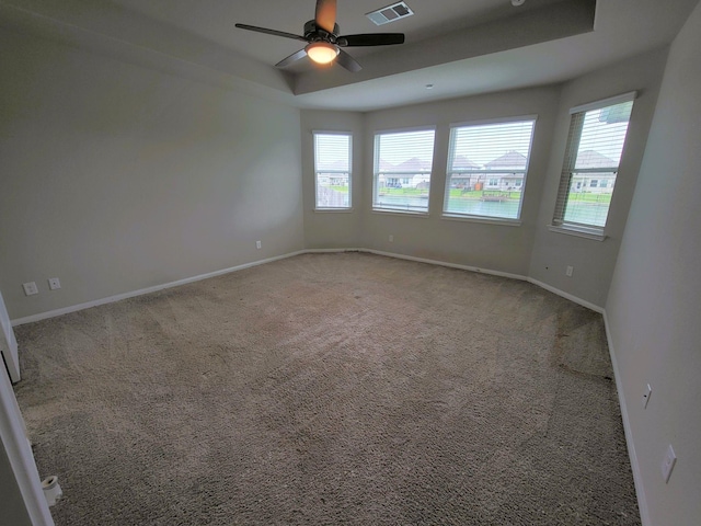 24703 Allori Ct, Katy, TX 77493 - empty room with healthy amount of natural light, carpet flooring, ceiling fan, and baseboards