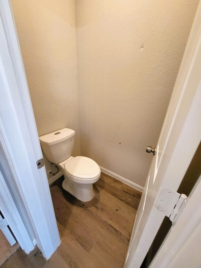 24703 Allori Ct, Katy, TX 77493 - bathroom featuring wood finished floors, toilet, and baseboards