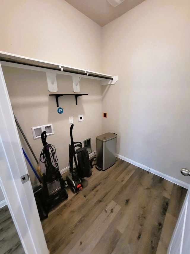 24703 Allori Ct, Katy, TX 77493 - washroom featuring electric dryer hookup, wood finished floors, washer hookup, and baseboards