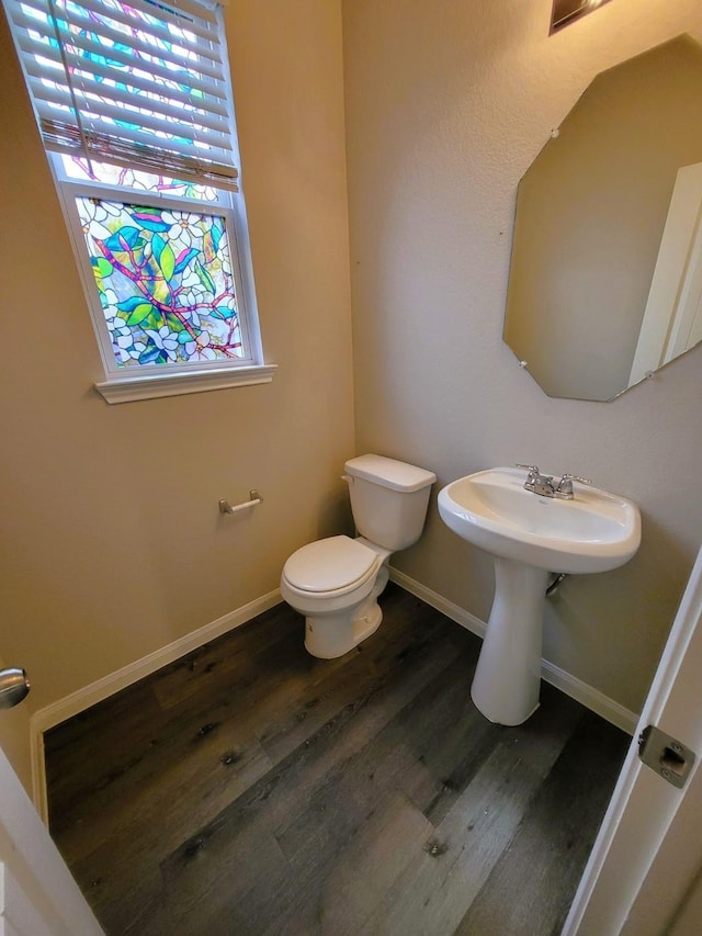 24703 Allori Ct, Katy, TX 77493 - bathroom with toilet, wood finished floors, and baseboards