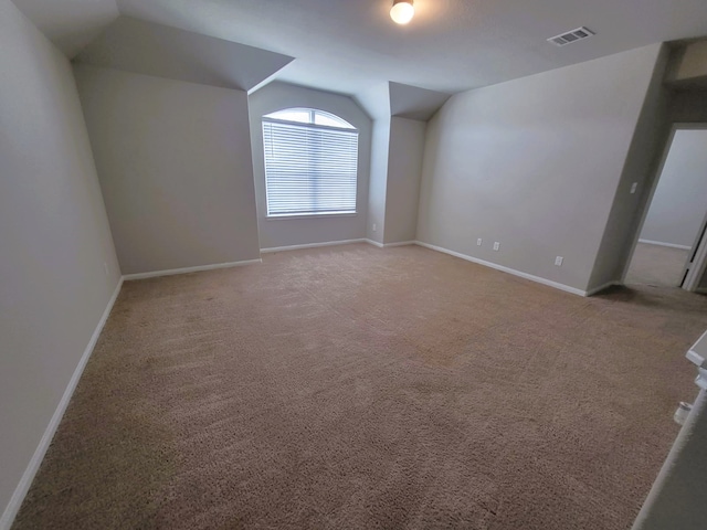 24703 Allori Ct, Katy, TX 77493 - additional living space with lofted ceiling, carpet, and baseboards