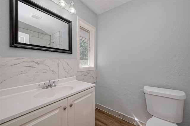 10613 Buffum St, Houston, TX 77051 - bathroom featuring wood finished floors, toilet, vanity, and baseboards