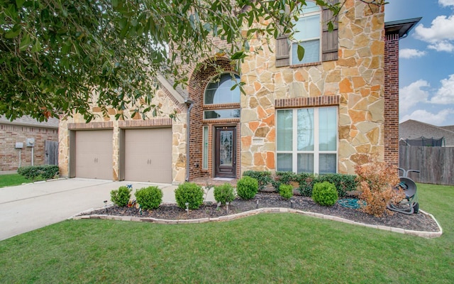 1202 Watercrest Park Ln, Rosenberg, TX 77471 - view of front of house featuring stone siding, driveway, a garage, and brick siding