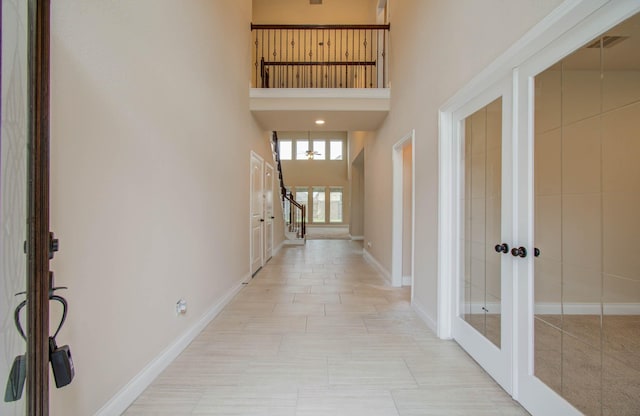 1202 Watercrest Park Ln, Rosenberg, TX 77471 - entrance foyer with french doors, a high ceiling, baseboards, and stairway