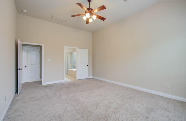 1202 Watercrest Park Ln, Rosenberg, TX 77471 - unfurnished bedroom featuring light colored carpet, lofted ceiling, baseboards, ensuite bathroom, and ceiling fan