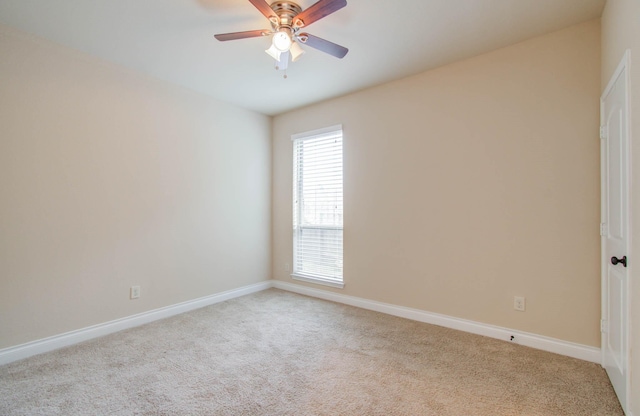 1202 Watercrest Park Ln, Rosenberg, TX 77471 - empty room featuring light colored carpet, baseboards, and a ceiling fan