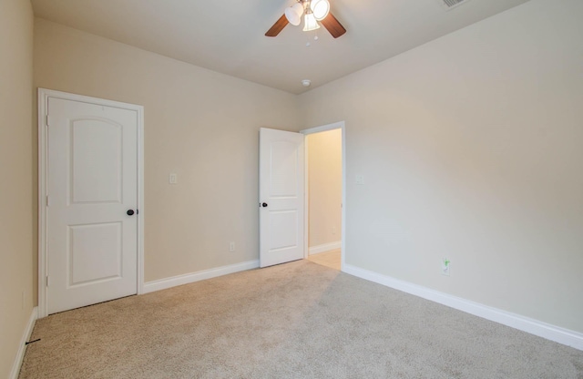 1202 Watercrest Park Ln, Rosenberg, TX 77471 - unfurnished bedroom featuring carpet flooring, baseboards, and ceiling fan