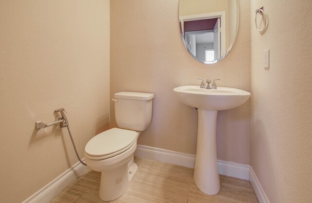 1202 Watercrest Park Ln, Rosenberg, TX 77471 - half bath featuring toilet and baseboards