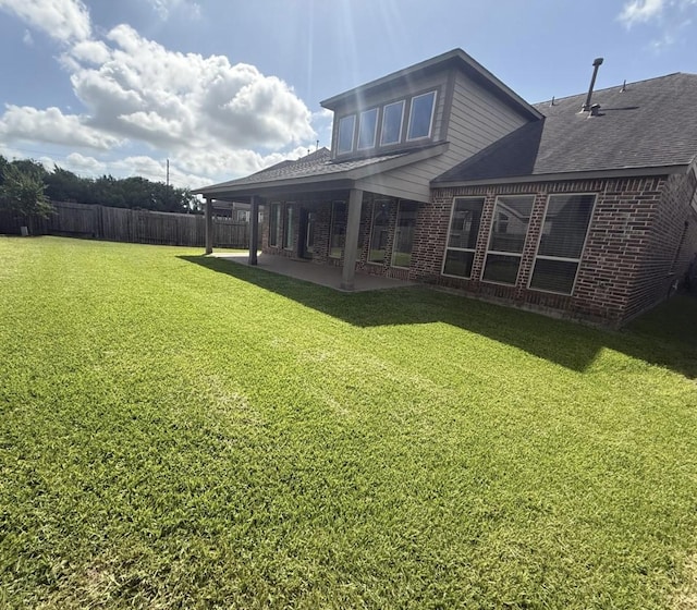 1202 Watercrest Park Ln, Rosenberg, TX 77471 - rear view of house featuring brick siding, a patio, and roof with shingles
