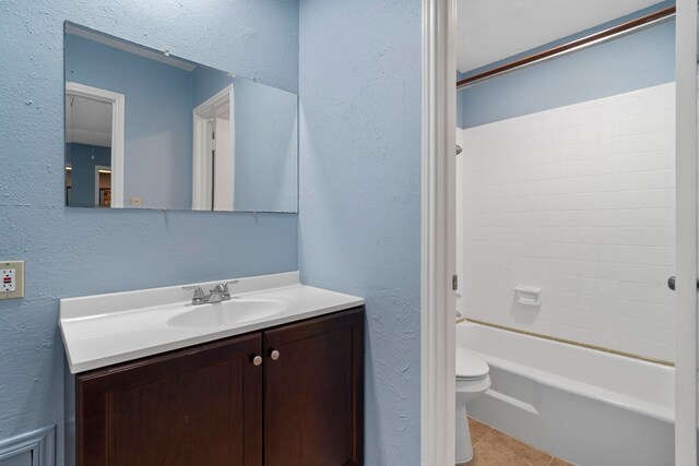 8952 Wilcrest Dr Unit 8952, Houston, TX 77099 - full bathroom with vanity, toilet, tile patterned floors, shower / bath combination, and a textured wall