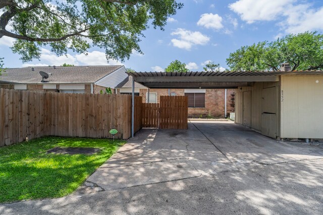 8952 Wilcrest Dr Unit 8952, Houston, TX 77099 - exterior space featuring a carport