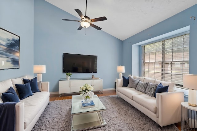 8952 Wilcrest Dr Unit 8952, Houston, TX 77099 - living room featuring ceiling fan, wood finished floors, baseboards, and high vaulted ceiling