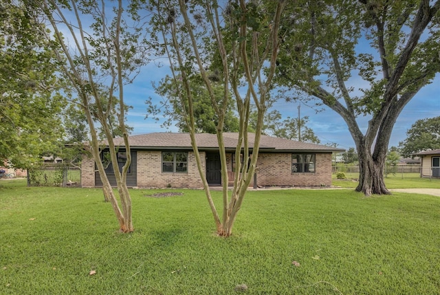 229 Burkett St, Richwood, TX 77531 - ranch-style home featuring a front lawn and brick siding