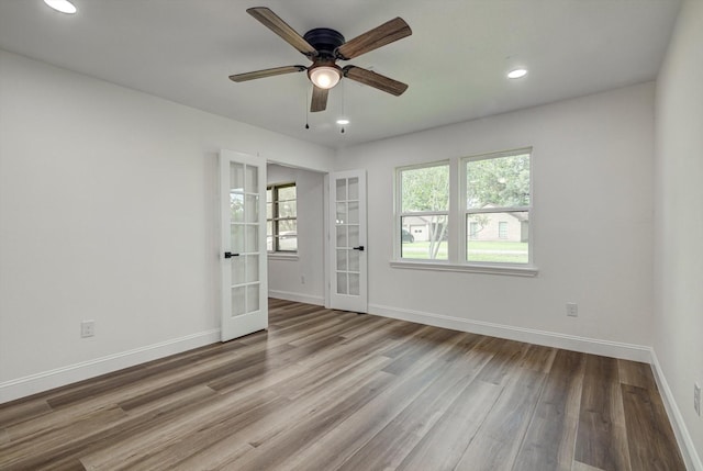 229 Burkett St, Richwood, TX 77531 - spare room featuring french doors, wood finished floors, ceiling fan, and recessed lighting