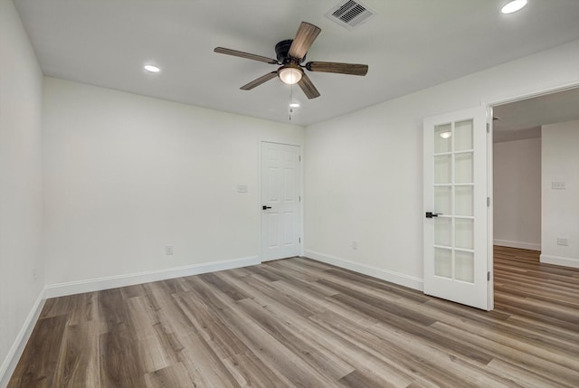 229 Burkett St, Richwood, TX 77531 - spare room with wood finished floors, recessed lighting, a ceiling fan, and french doors