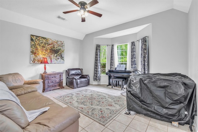 19311 Oak Station Dr, Humble, TX 77346 - living room featuring vaulted ceiling, light tile patterned flooring, and ceiling fan