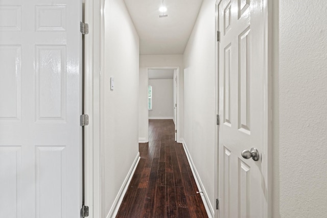 12006 Acorn Oak St, The Woodlands, TX 77380 - hall featuring dark wood-style flooring and baseboards