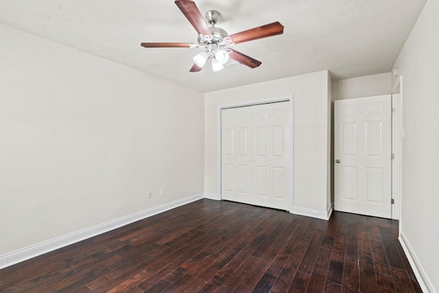 12006 Acorn Oak St, The Woodlands, TX 77380 - unfurnished bedroom with dark wood-style floors, baseboards, a closet, and a ceiling fan