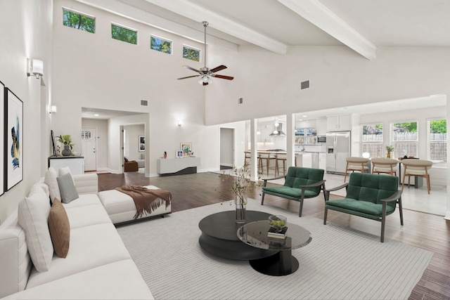 12006 Acorn Oak St, The Woodlands, TX 77380 - living area featuring wood finished floors, beamed ceiling, a ceiling fan, and high vaulted ceiling