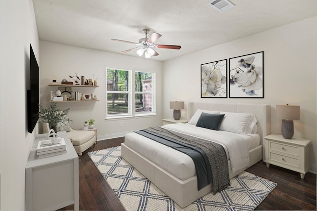 12006 Acorn Oak St, The Woodlands, TX 77380 - bedroom with dark wood-style flooring, baseboards, and a ceiling fan