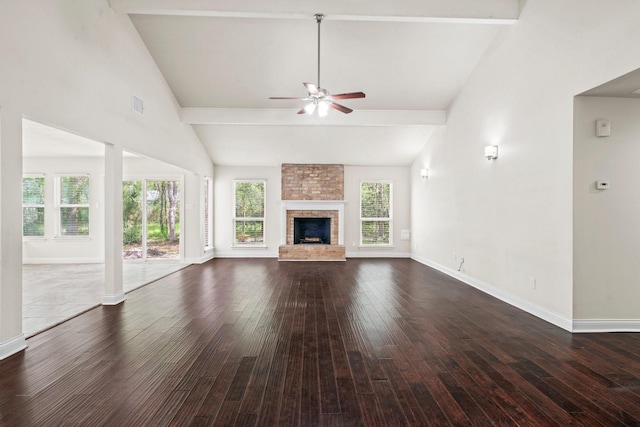 12006 Acorn Oak St, The Woodlands, TX 77380 - unfurnished living room with a ceiling fan, baseboards, dark wood-style flooring, a fireplace, and high vaulted ceiling