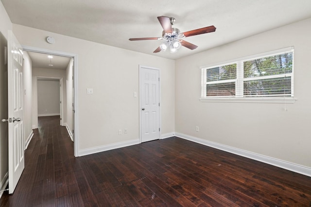 12006 Acorn Oak St, The Woodlands, TX 77380 - unfurnished bedroom with hardwood / wood-style floors, baseboards, attic access, and a ceiling fan