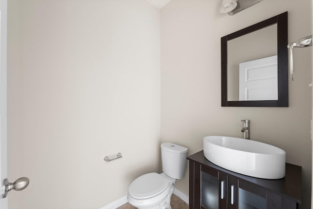 18115 Fernwood Bend Dr, Tomball, TX 77377 - half bathroom featuring vanity, toilet, and baseboards