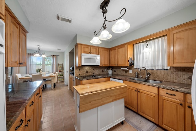 14107 Ravenhurst Ln, Houston, TX 77070 - kitchen with white appliances, wood counters, a sink, decorative backsplash, and light tile patterned floors
