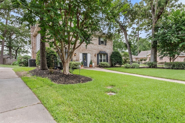 14107 Ravenhurst Ln, Houston, TX 77070 - view of front of home featuring brick siding and central AC unit