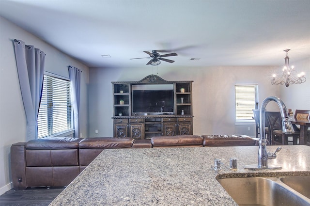 12413 S Hill Ct, Magnolia, TX 77354 - living room with ceiling fan, a chandelier, dark wood-style flooring, and baseboards