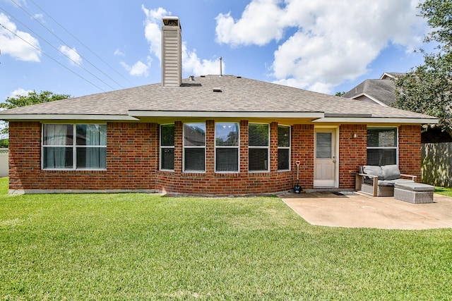 2627 Old River Ln, Richmond, TX 77406 - back of property featuring a patio area, a chimney, brick siding, and a yard