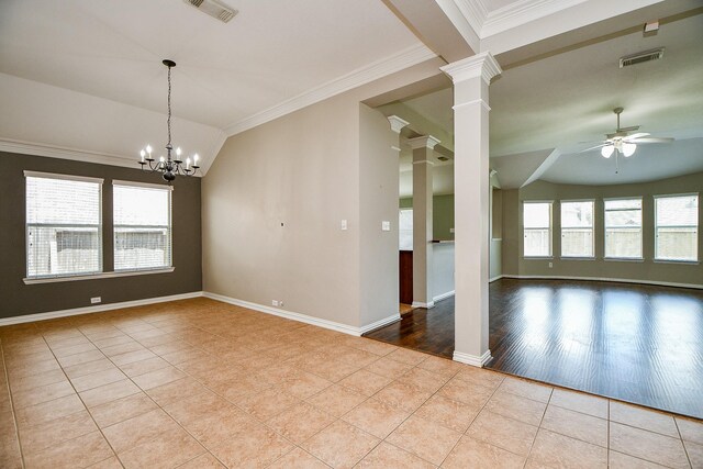 2627 Old River Ln, Richmond, TX 77406 - spare room with tile patterned flooring, lofted ceiling, ceiling fan, ornate columns, and a chandelier