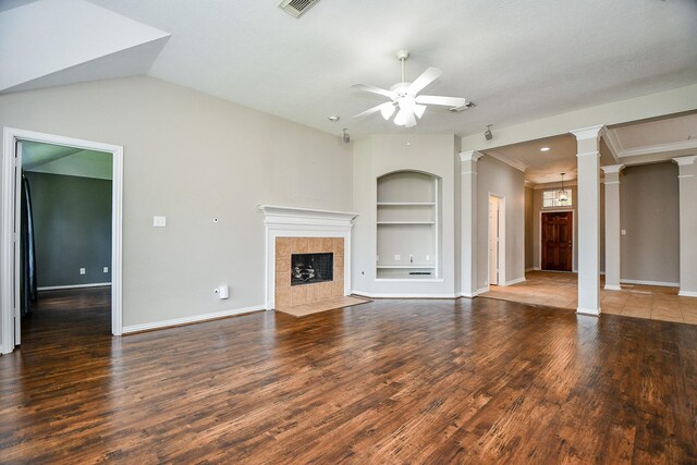 2627 Old River Ln, Richmond, TX 77406 - unfurnished living room featuring ornate columns, built in features, ceiling fan, wood finished floors, and baseboards