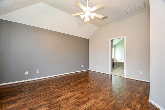 2627 Old River Ln, Richmond, TX 77406 - spare room featuring vaulted ceiling, wood finished floors, ceiling fan, baseboards, and a textured ceiling