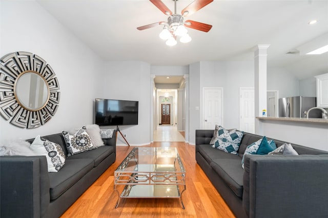 3510 Brookstone Ct, Pearland, TX 77584 - living area featuring ornate columns, ceiling fan, wood finished floors, recessed lighting, and lofted ceiling