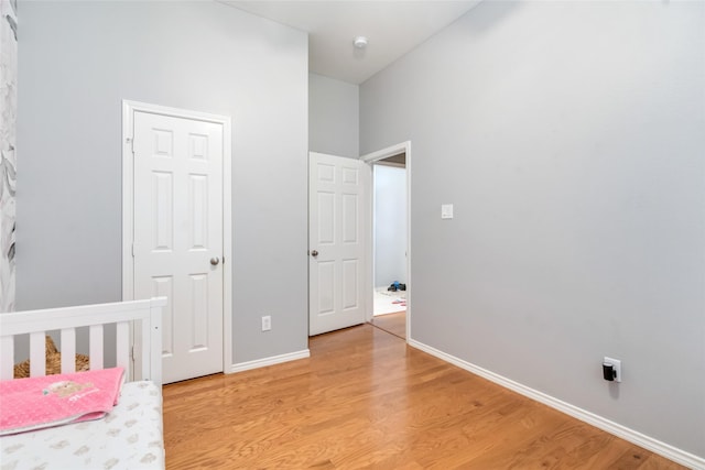 3510 Brookstone Ct, Pearland, TX 77584 - unfurnished bedroom featuring light wood finished floors and a towering ceiling